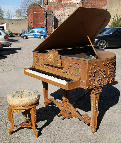 Claviano grand piano built for songwriter and film star Ivor Novello. This piano has an ornately carved, rococo style case with gilt accents