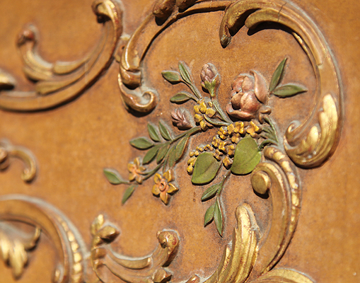 Claviano cabinet showing ornate rococo carvings with gilt accents