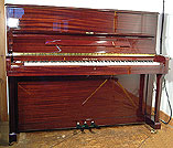 A brand new Halle & Voight upright piano with a mahogany case and polyester finish.