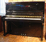 A brand new Halle & Voight upright piano with a black case and polyester finish.