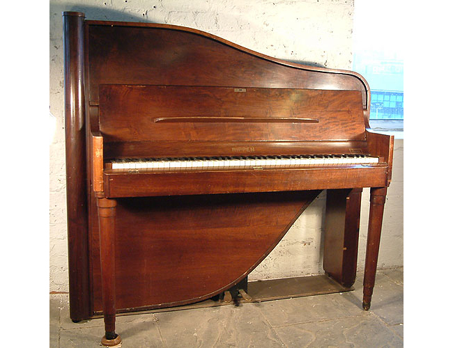 A  Rippen upright piano with a polished, walnut case