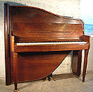 An art cased Rippen upright piano with a polished, walnut case. 