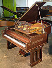 An arts and crafts Ibach Grand with a polished, mahogany case. Designed by Dutch Architect Pierre Joseph Hubert Cuypers, famous for designing the Rijksmuseum and Central Station in Amsterdam.