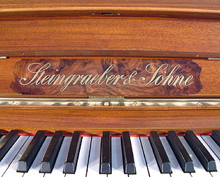 Art cased Steingraeber upright Piano for sale. 