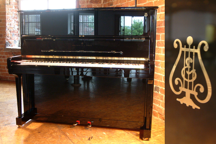 Brand new,  Steinway Model K  upright piano with a black case and polyester finish