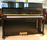 A brand new Wendl & Lung Model 122 upright piano with a black case and polyester finish. 