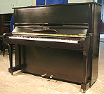 A Steinway Model V upright piano with a black case and polished finish. 
