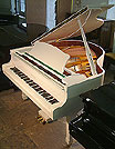 AA brand new Halle & Voight baby grand piano with a white case and polyester finish.