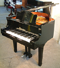 A Schoenhut half-size grand piano with a black case and polyester finish. Ideal to inspire a childs interest in the piano at a young age. Comes with matching piano stool.