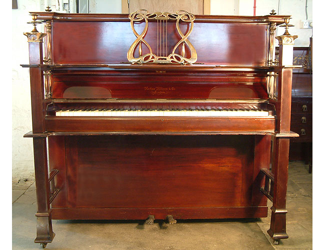 An  Allison exhibition upright piano with a polished, mahogany with elaborate bronze mountings. Art nouveau style music stand