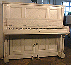 An art cased Besbrode upright piano and drinks cabinet. Case painted with Italian marble effect. No instrument. Lights up and everything.