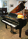 A brand new Halle & Voight grand piano with a black case and polyester finish with a Pianoforce player system installed.