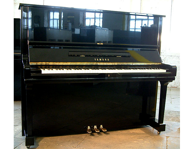 A Yamaha U3 upright piano with a black case and polyester finish