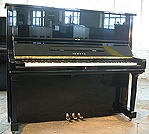 A Yamaha U3 upright piano with a black case and polyester finish. 