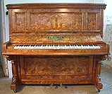 A Bishop upright piano with an intricately inlaid walnut case. Inlaid with grecian ladies, cherubs and musical intruments.
