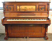 A Cahn & Cahn upright piano with a polished rosewood case, beautifully inlaid with a japanese inspired landscape