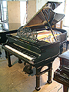 An antique Bluthner grand piano with a polished, black case formerly owned by Arthur Bliss. 