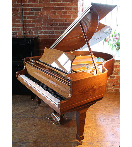  A brand new, Steinway Model M grand piano with a walnut case and polyester finish 