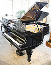 A restored, antique Bluthner grand piano with a polished, black case