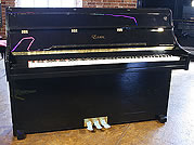 Piano for sale. A brand new, Essex 108 upright piano with a black case and polyester finish. 