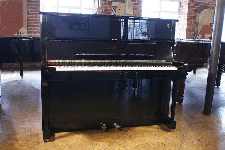 Brand new,  Steinway Model V upright piano with a black case and polyester finish