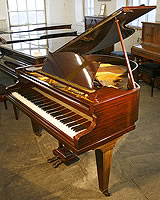 A Bechstein Model S grand piano with a polished, mahogany case. 