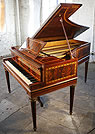 An Erard grand piano with an inlaid, mahogany case.