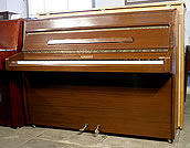 A Knight upright piano with a mahogany case. 