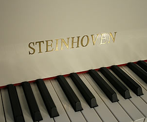 A brand new Steinhoven Model 148 baby grand piano with a white case and polyester finish White Steinhoven Model 148 Baby Grand Piano for sale. We are looking for Steinway pianos any age or condition.