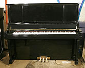 Piano for sale. A brand new Steinhoven upright piano with a black case. 