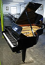 A  Grotrian Steinweg model 189 grand piano with a black case