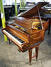 A Schiedmayer grand piano with an inlaid, rosewood case. 