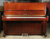 A Yamaha U1A upright piano with a mahogany case and polyester finish. 