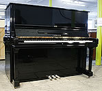 A Yamaha U3 upright piano with a black case and polyester finish. 
