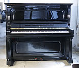 An antique Steinway upright piano with a black case.