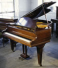 A Bechstein Model S grand piano with a polished, mahogany case. 