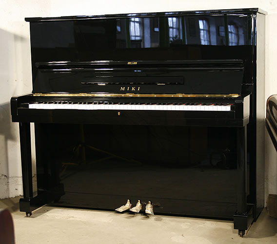 Miki upright Piano for sale.