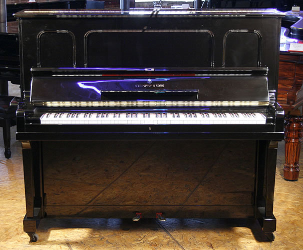 Steinway Model K upright Piano for sale with an black case.