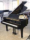 A Yamaha C3 grand piano for sale with a black case and polyester finish. 