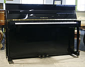 A Yamaha MP70N upright piano with a black case and polyester finish. 