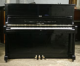 A Yamaha U1 upright piano with a black case and polyester finish. 