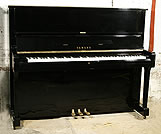 A Yamaha U1 upright piano with a black case and polyester finish. 