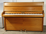 A Knight upright piano with a mahogany case. 