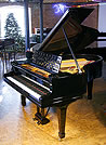 A rebuilt Steinway Model O grand piano with a black case.