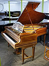 An 1884,  Bechstein Model B grand piano with an inlaid, mahogany case and gate legs. 