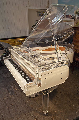 Brand new,  Steinhoven grand piano with a transparent, acrylic case. Piano has an eighty-eight note keyboard and a three-pedal piano lyre.