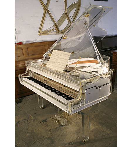 A brand new, Steinhoven grand piano with a transparent, acrylic case