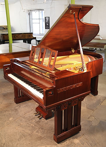 An Arts and Crafts Ibach grand piano with a polished, mahogany case. Designed by Dutch Architect Pierre Joseph Hubert Cuypers, famous for designing the Rijksmuseum and Central Station in Amsterdam.