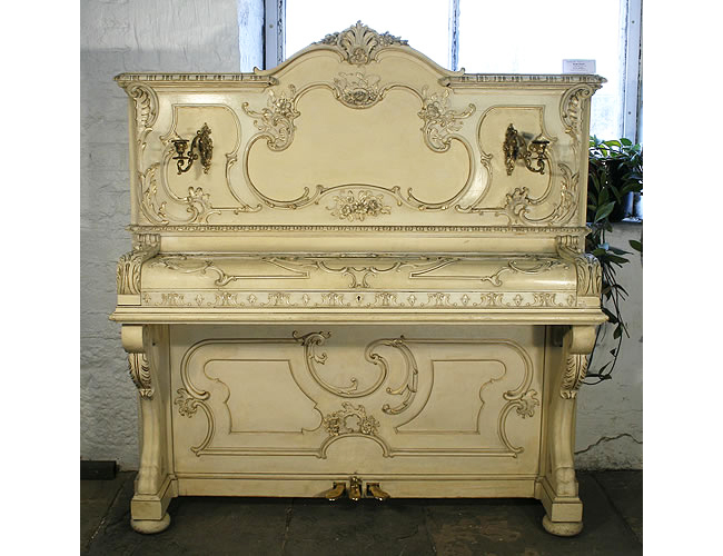  A  restored, 1903, Ibach upright piano with an ornately carved, rococo style case with gilt detail