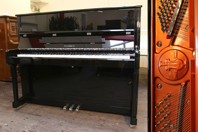 Brand new,   Feurich Model 122 upright piano with a black case